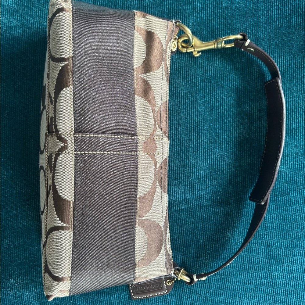 Coach Signature Brown and Cream Zipper Hand Bag. 10” x 3”